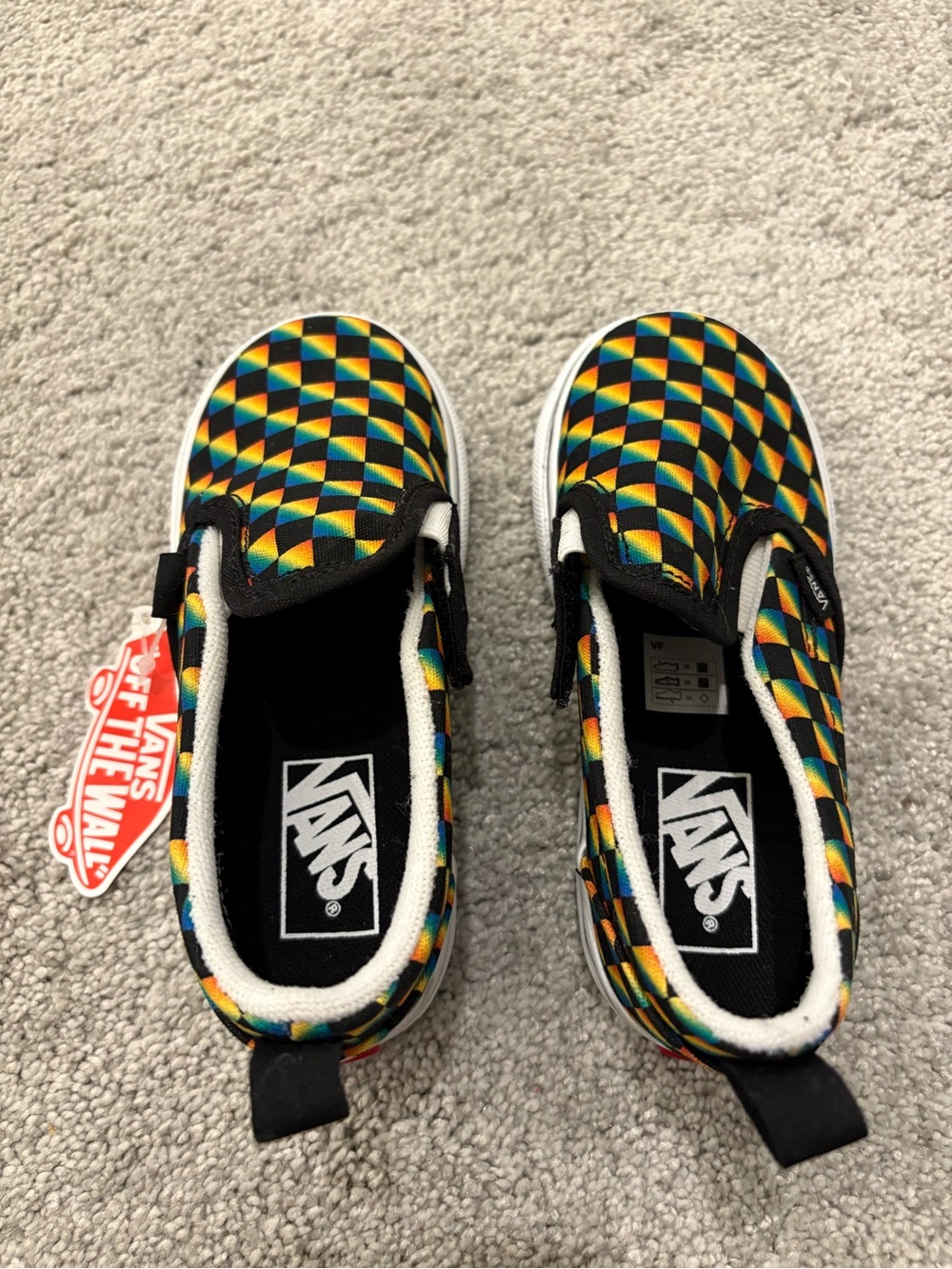 Vans Kids Slip-On Sneakers in Black with Rainbow Geometric Print